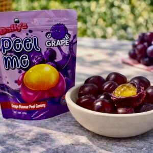 A 65g purple bag of Daffy’s Peel Me Grape Gummy Candy, featuring soft, peelable, and halal-certified grape-flavored gummies