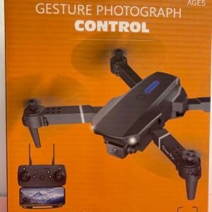 The front of a bright orange retail box for the Drone Pro, featuring the drone itself, its remote controller with smartphone mount, and icons for 50x zoom and dual cameras.
