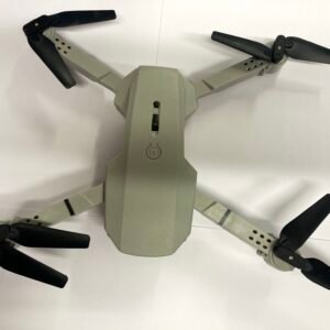 Top-down view of a gray quadcopter drone with rotating propellers and glowing blue LED indicator lights.