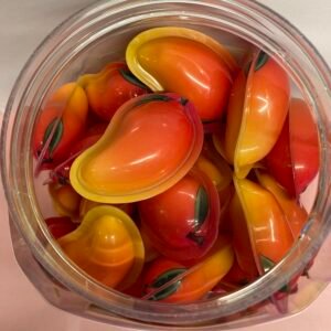 A 50-piece display box of individually wrapped halal 18g Mango Jelly Filled Gummies with a vibrant yellow chewy exterior and liquid fruit center.