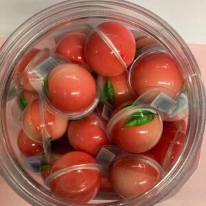 A 50-piece display box of individually wrapped 18g Peach Jelly Filled Gummies with an orange-pink chewy shell and liquid fruit center.