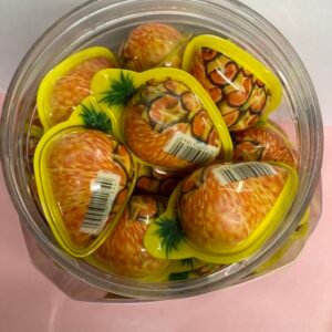 A bulk display of 50 individually wrapped 18g Pineapple Jelly Filled Gummies with a yellow chewy shell and juicy tropical center.