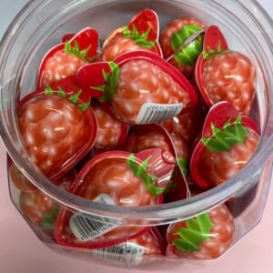 A bulk container of 50 individually wrapped halal 18g Raspberry Jelly Filled Gummies with a pink chewy exterior and liquid fruit center.