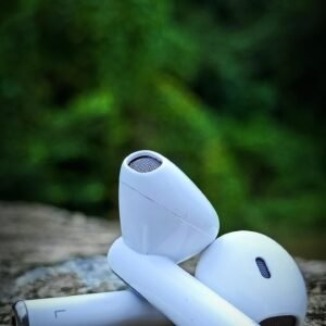 Pair of white TWS wireless earbuds with a lightweight in-ear design and Bluetooth 5.0 connectivity for iPhone and Android devices.