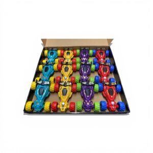 A retail display box filled with assorted dinosaur-themed stunt cars in red, blue, and yellow with oversized 4WD tires and 360-degree flip capabilities.