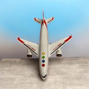 A top-down view of a white Nile Airbus toy plane with red accents, featuring four colorful interactive buttons (yellow, green, blue, red) for music and stories.