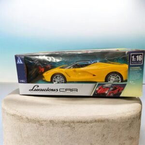 A yellow 1:16 scale remote control supercar toy in its original "Luxurious Car" packaging, showing features like forward, backward, left, and right turns for ages 6 and up.
