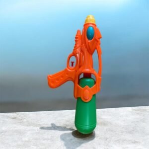 An orange and green small water spray bottle toy with a blue oval accent and yellow nozzle, standing vertically on a light gray surface against a blue background.