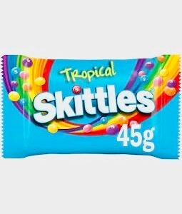 A 45g grab bag of Skittles Tropical featuring light blue packaging and exotic-colored chewy candies with tropical fruit flavors.