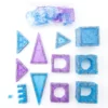 Overhead flat lay of 48 blue and purple magnetic castle tiles and modular window inserts